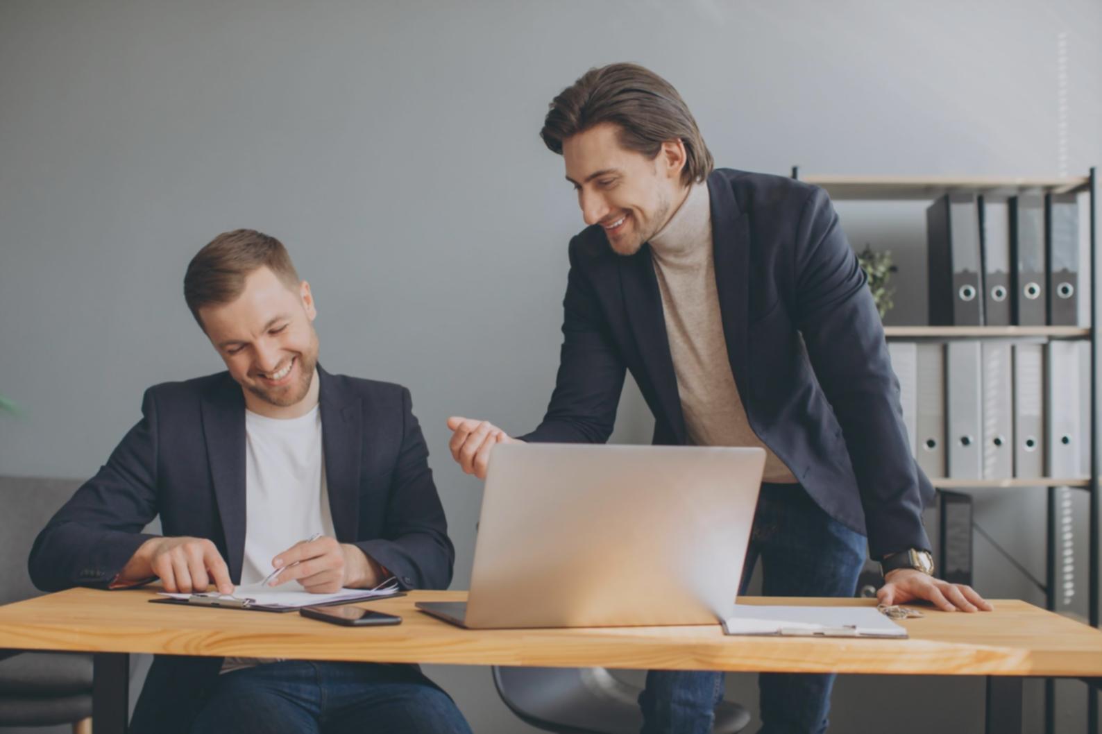 Students working together on investment analysis during workshop session